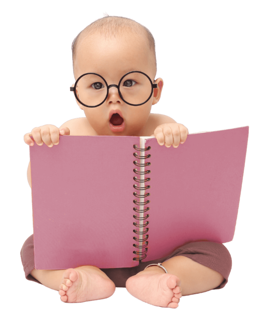 Baby sitting up and holding a large open pink notebook. The baby is nearly bald, and is staring open-mouthed at the viewer, as if in shock. There are large round glasses on the baby's face. The notebook is pink and spiral bound. (Joey333, Getty Images)